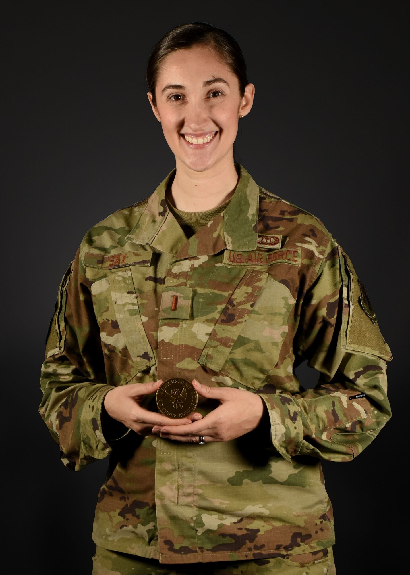 Photo of an Airman standing with a medal