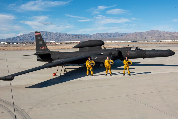 Three pilots pose for a photo.