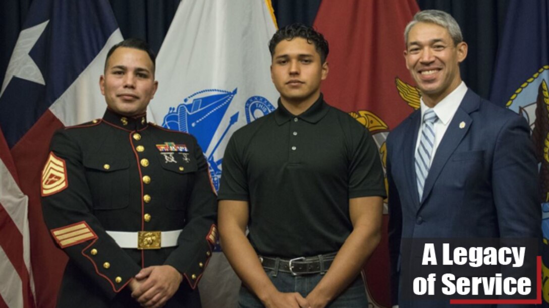 Julio Garcia, center, an enlistee in the U.S. Marine Corps, celebrates with Marine Gunnery Sgt. Angel Gonzalez, a recruiter with Recruiting Station San Antonio, and Ron Nirenberg, the mayor of San Antonio, following his enlistment ceremony at Joint-Base San Antonio Fort Sam Houston, Texas, on Dec. 10, 2019. Nirenberg attended the enlistment ceremony to support his nephew, Garcia, in his decision to join the Marine Corps.