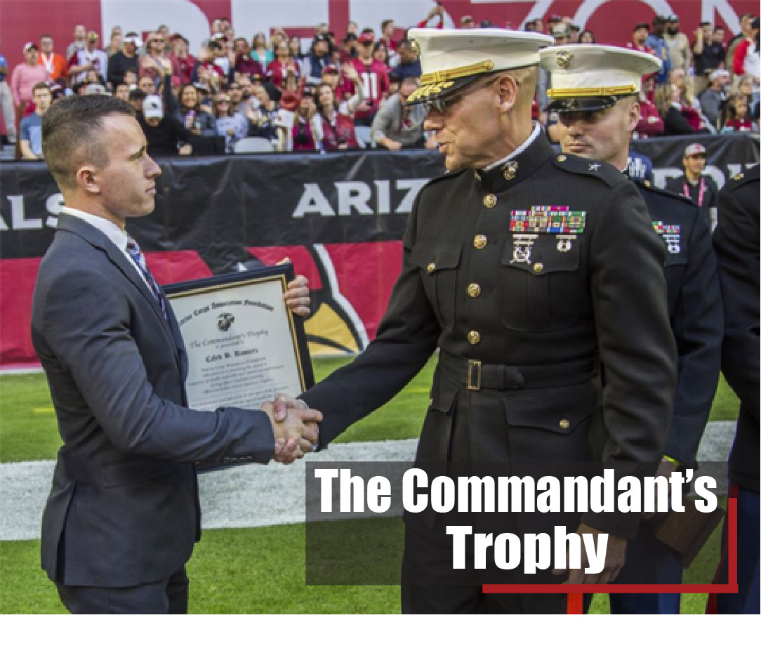 Candidate Caleb Ramirez, the honor graduate of Platoon Leaders Course Combined 20, was awarded the Marine Corps Commandants Trophy during the Arizona Cardinals' football game in Glendale, Arizona, on Dec. 1, 2019. Brigadier General Ryan P. Heritage, the commanding general of the Marine Corps Western Recruiting Region, presented the trophy to both Ramirez and the University of Arizona. The Platoon Leaders Course Combined is a 10-week training event designed to screen and evaluate potential Marine Corps Officers. Those who successfully complete the period of instruction are commissioned as Second Lieutenants in the United States Marine Corps.
