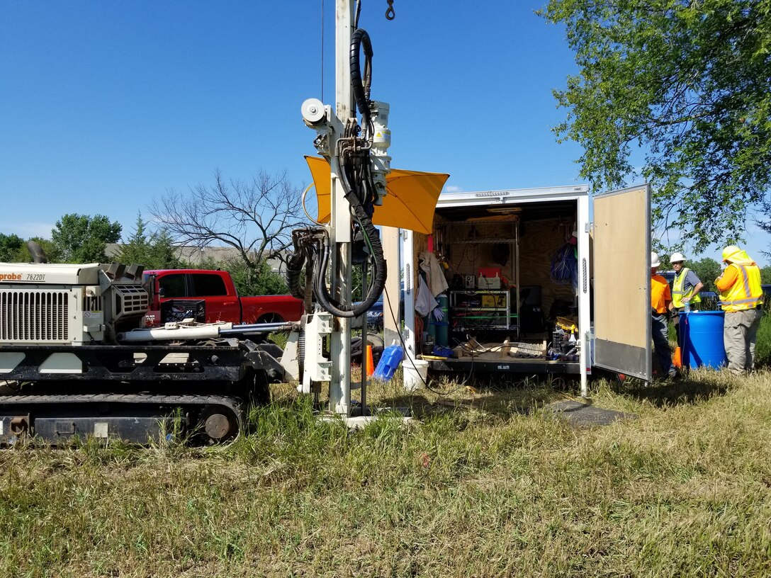 The membrane interface and hydraulic profiling tool (MiHPT) rig. Multiple probes are submerged approximately 100 feet below ground while real-time data is monitored within the trailer.