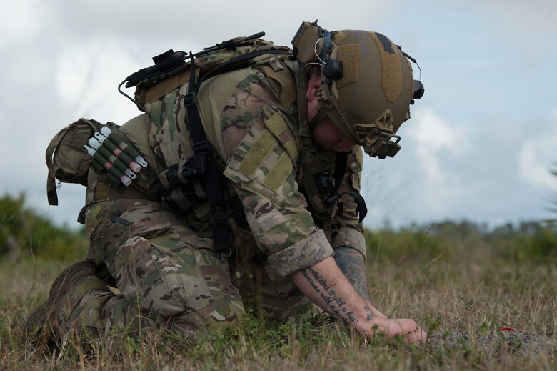 U.S. Air Force Staff Sgt. Taylor Lahteine, a 6th Civil Engineer Squadron explosive ordnance disposal (EOD) flight technician, works to secure a simulated explosive device during a field training exercise, Dec. 11, 2019, at Avon Park Air Force Range, Fla.  The MacDill EOD flight conducted training simulations for detecting and securing improvised explosive devices to prepare for real-world deployment operations.