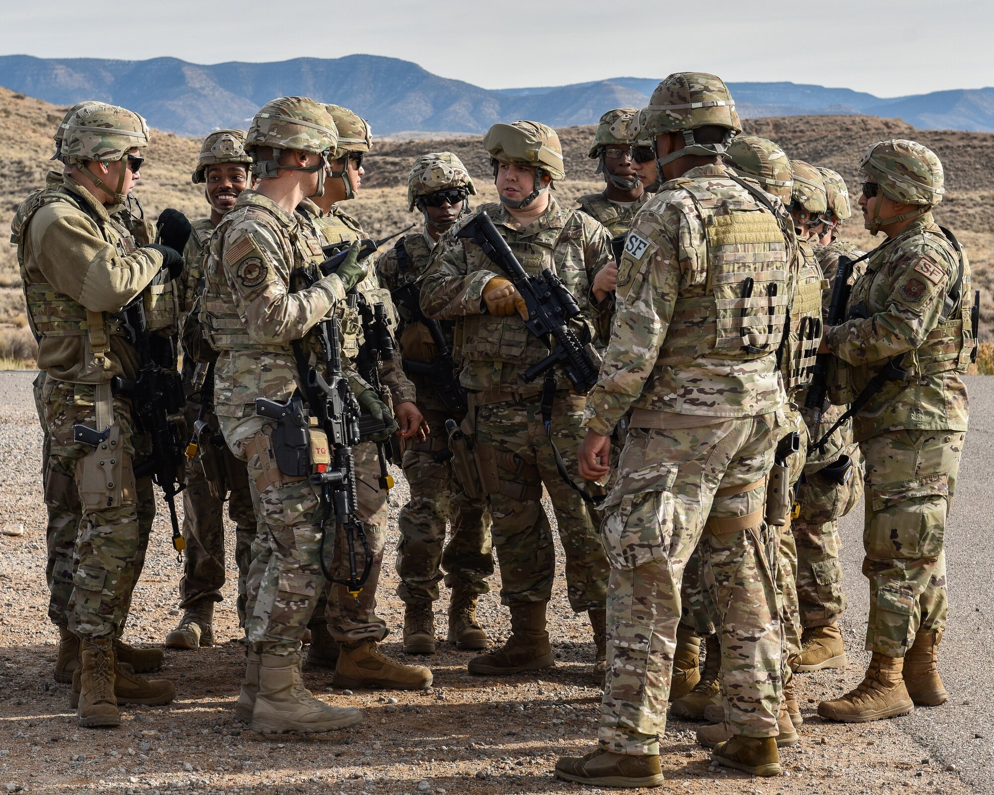 Security forces members huddle up before training.