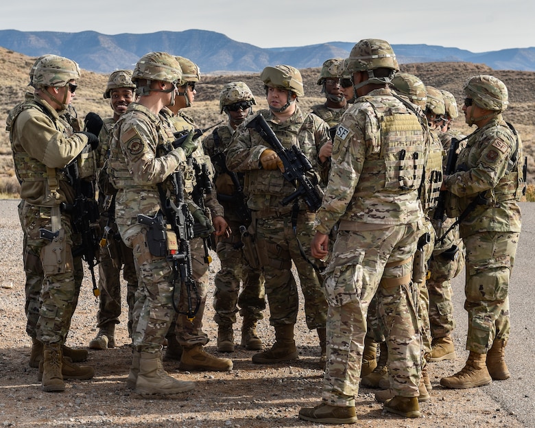 Security forces members huddle up before training.