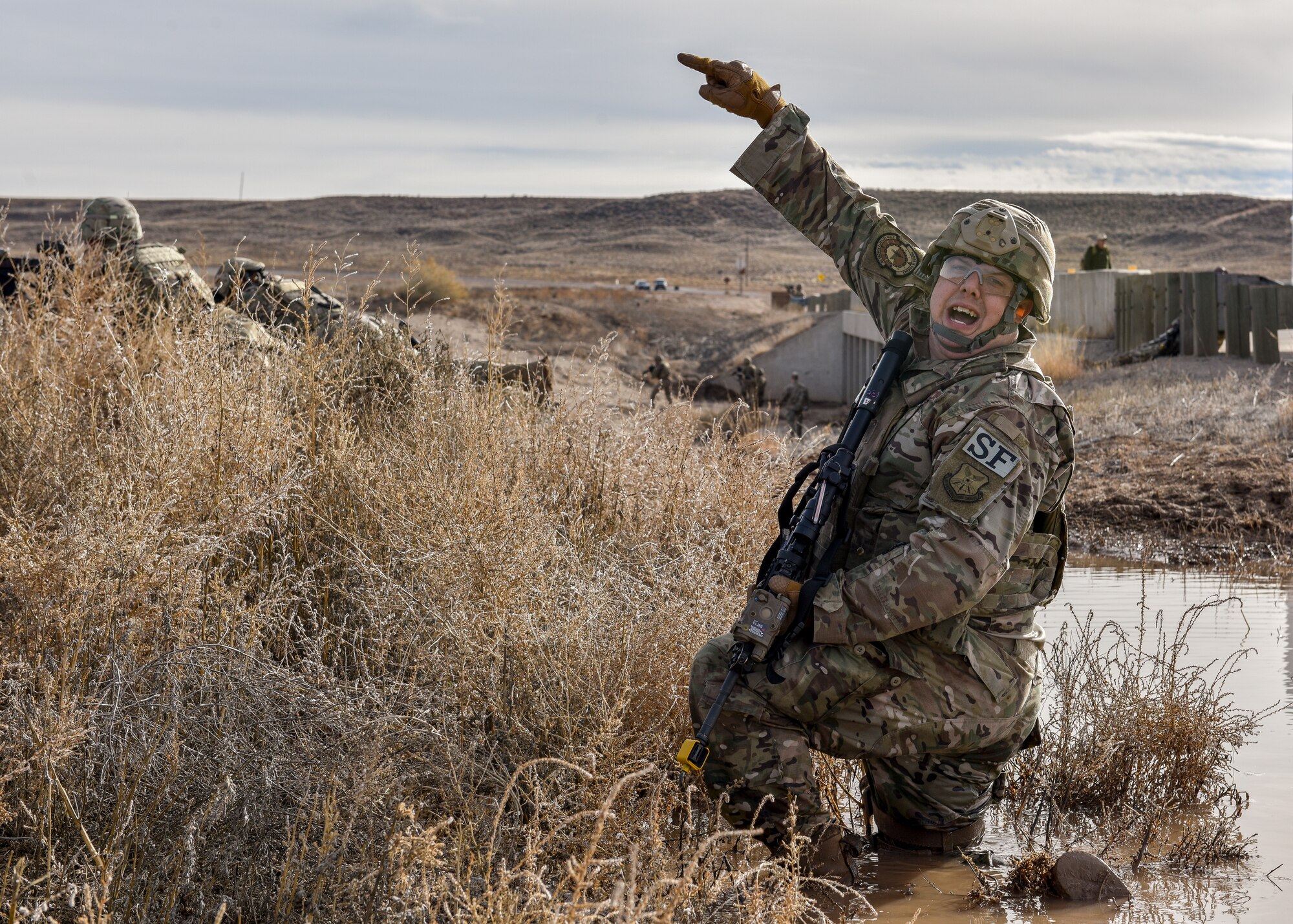 A security forces members shouts commands during training.