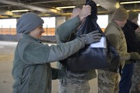 Staff Sgt. Kellie Daly helps load donated Christmas gifts as part of Operation Santa Claus on Dec. 16 in Concord. Volunteers from the State Employees' Association, SEIU Local 1984, partner with N.H. guardsmen annually to transport presents to distribution points throughout the state. The program has been led by the SEA since 1960, and ensures gifts are provided to thousands of NH children in need. (U.S. Air National Guard photo by Tech. Sgt. Aaron Vezeau)