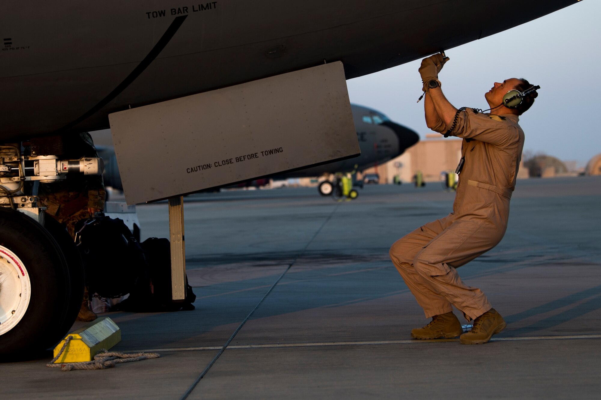A U.S. Air Force KC-135 Stratotanker pilot with the 28th Expeditionary Air Refueling Squadron performs preflight inspections on a Stratotanker at Al Udeid Air Base, Qatar, Dec. 3, 2019.