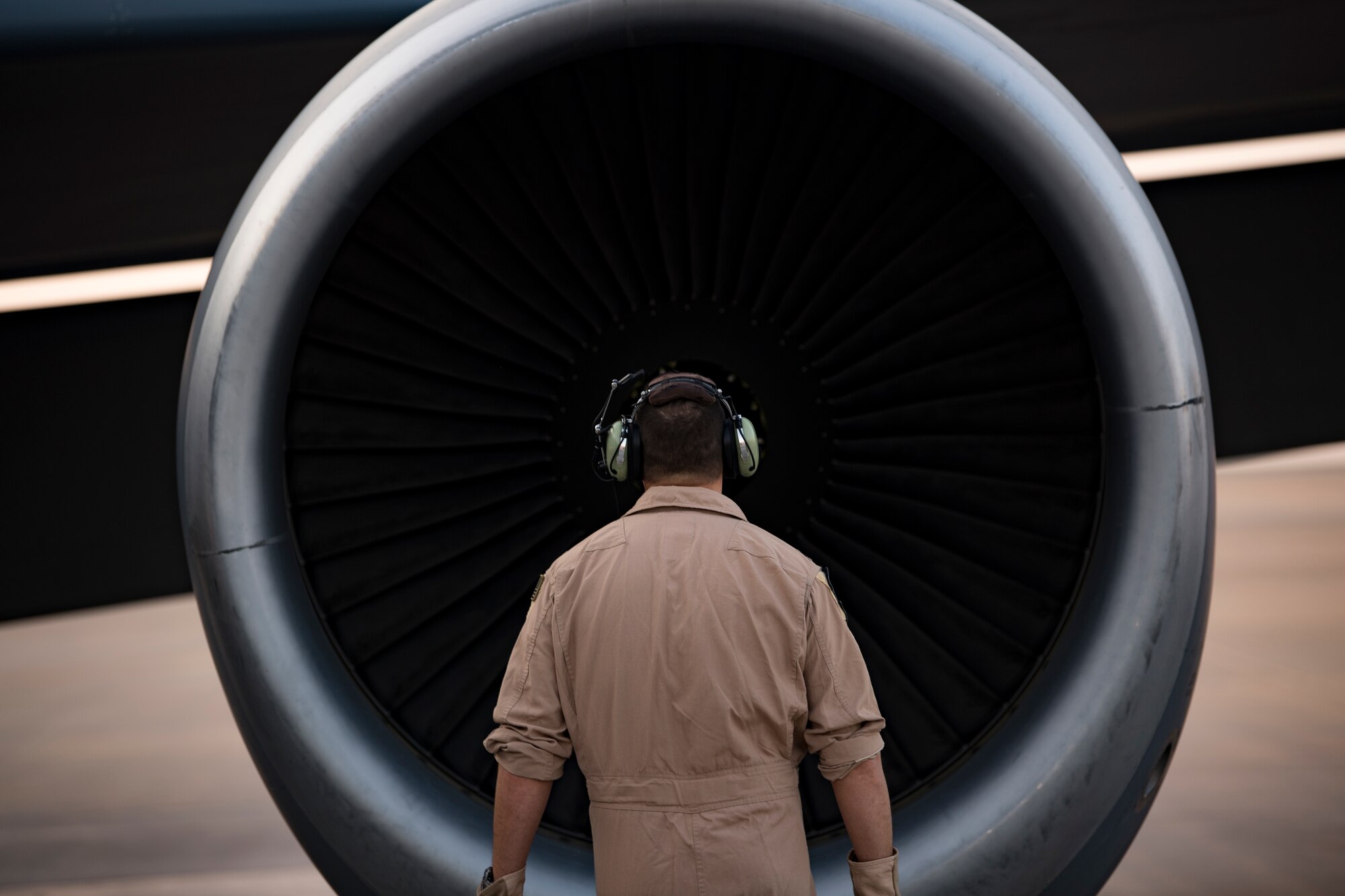 A U.S. Air Force KC-135 Stratotanker pilot with the 28th Expeditionary Air Refueling Squadron performs preflight inspections on a Stratotanker at Al Udeid Air Base, Qatar, Dec. 3, 2019.