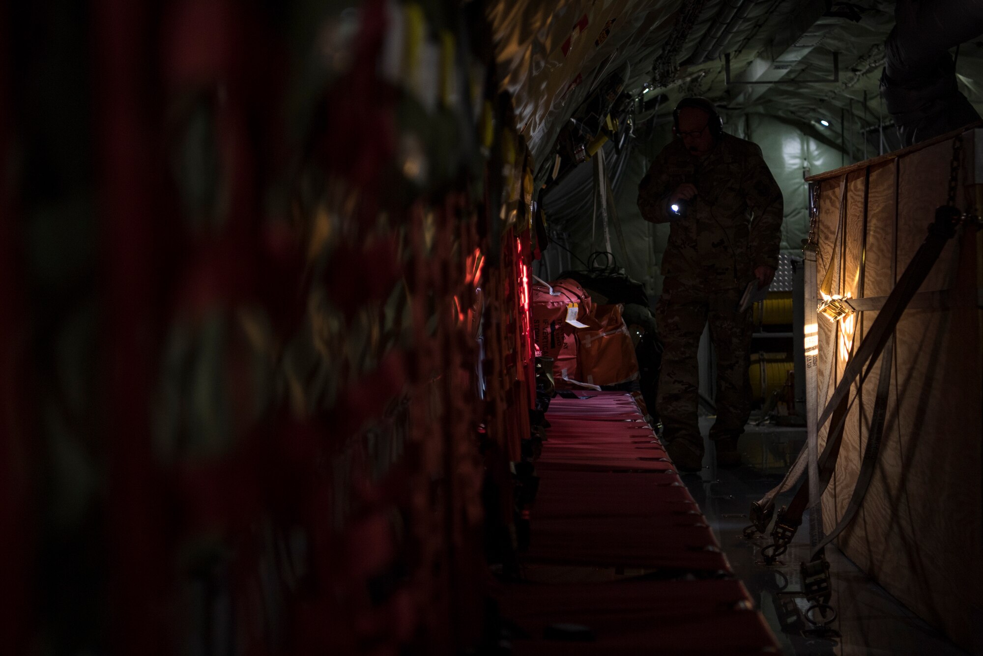 A U.S. Air Force KC-135 Stratotanker boom operator with the 28th Expeditionary Air Refueling Squadron performs preflight inspections on a Stratotanker at Al Udeid Air Base, Qatar, Dec. 3, 2019.