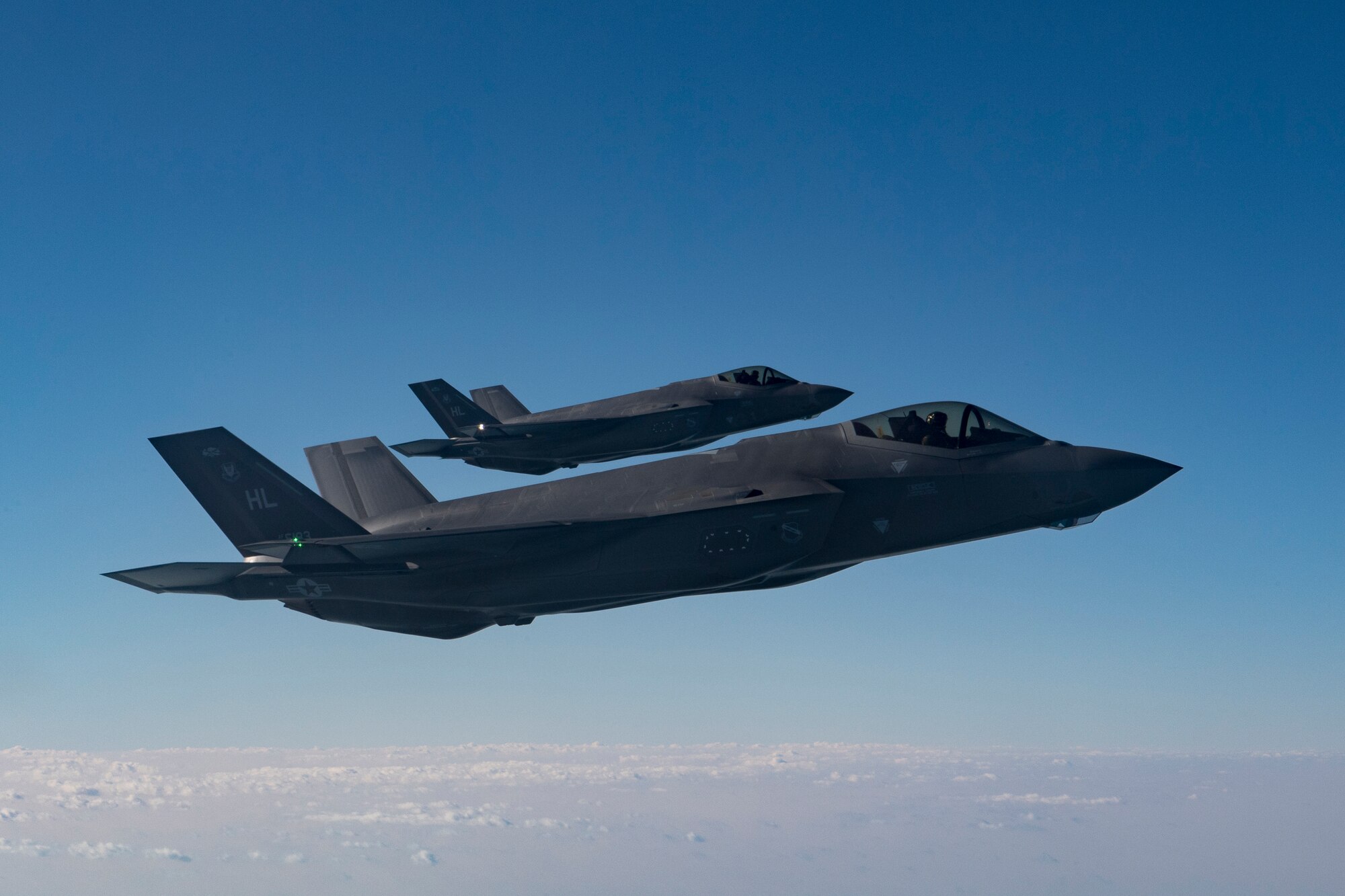 Two U.S. Air Force F-35A Lightning IIs assigned to the 34th Expeditionary Fighter Squadron fly above the Arabian Gulf, Dec. 3, 2019.