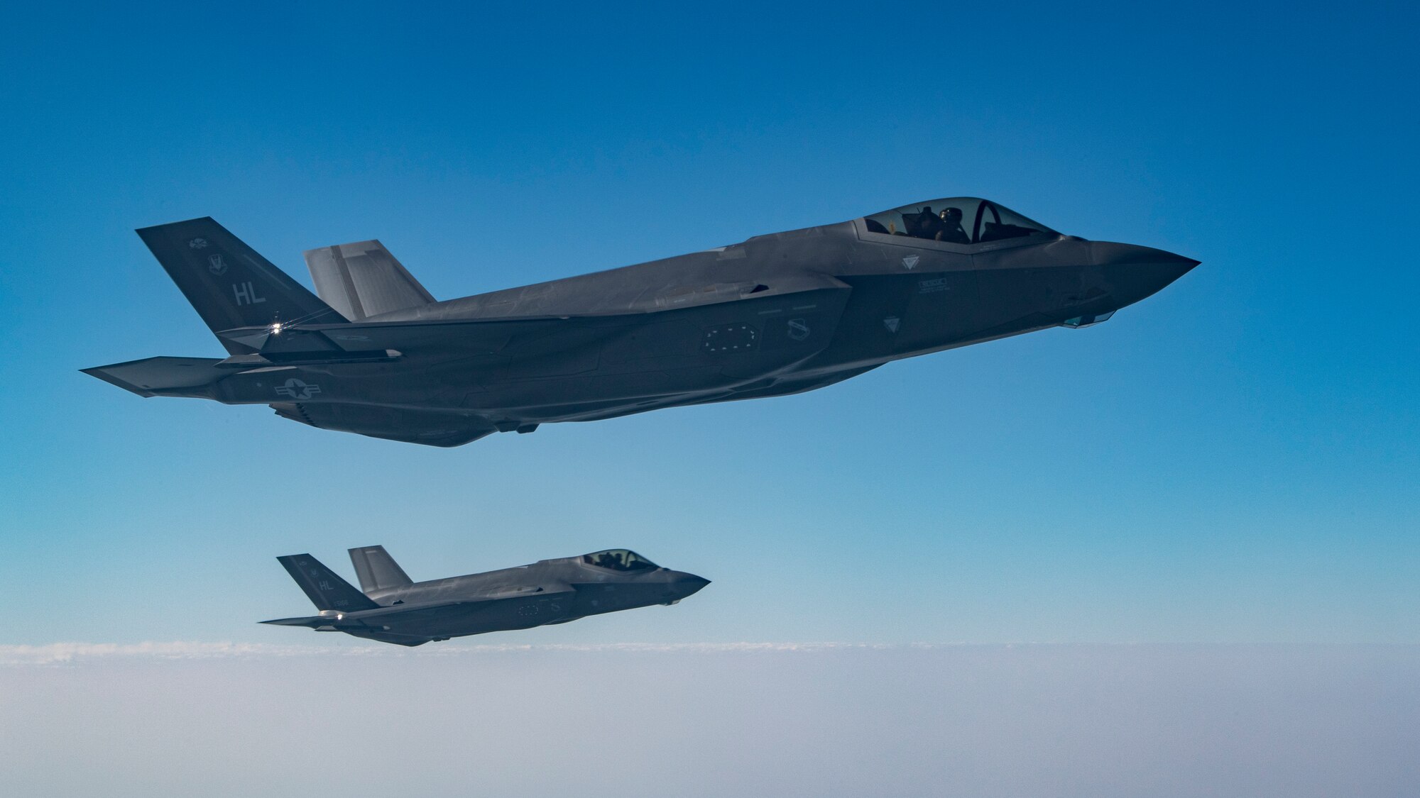 Two U.S. Air Force F-35A Lightning IIs assigned to the 34th Expeditionary Fighter Squadron fly above the Arabian Gulf, Dec. 3, 2019.