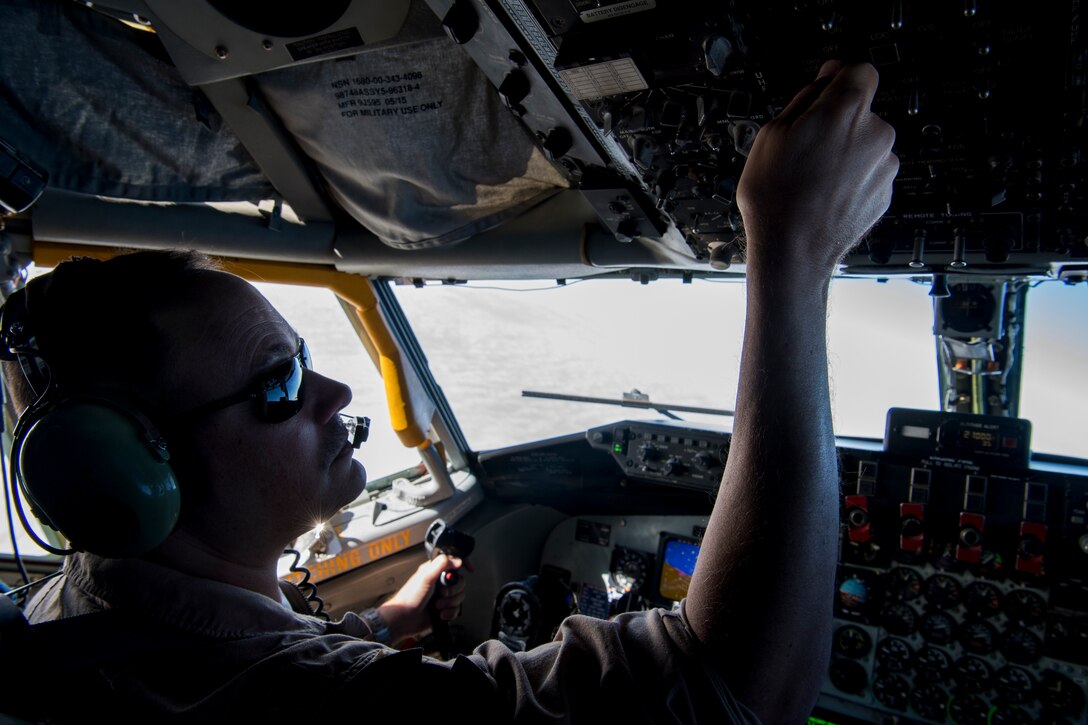 A U.S. Air Force KC-135 Stratotanker pilot with the 28th Expeditionary Air Refueling Squadron adjusts controls above the Arabian Gulf, Dec. 3, 2019.