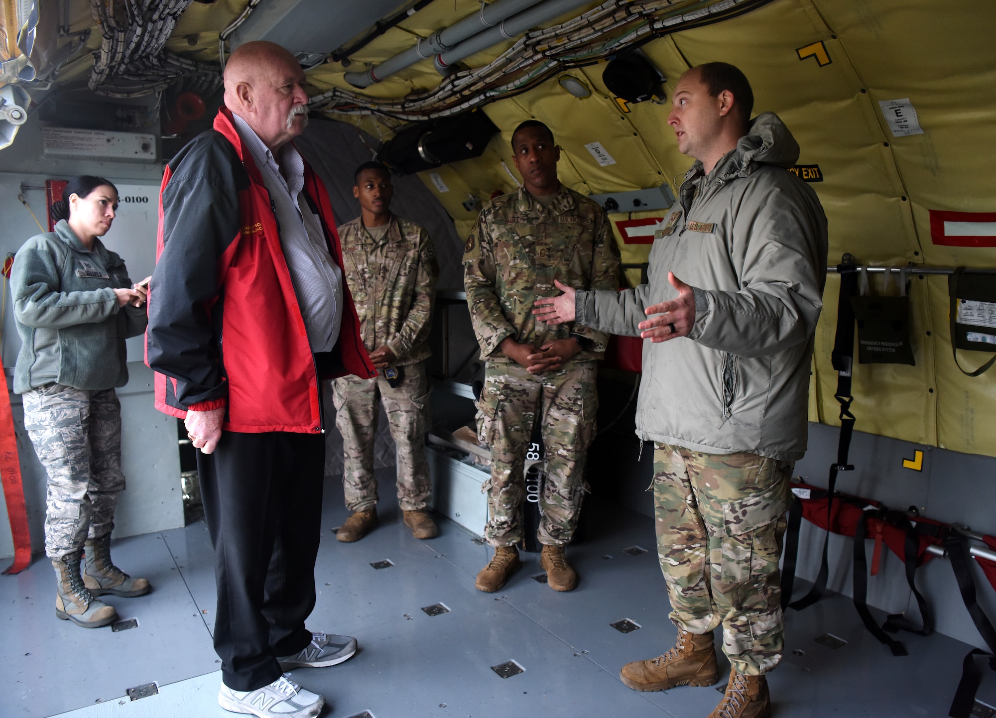 William “Doc” Schmitz, Commander-in-Chief for Veterans of Foreign Wars, receives a briefing on the capabilities of the KC-135 Stratotanker from Staff Sgt. Shannon Nations, 100th Aircraft Maintenance Squadron crew chief, during a visit to RAF Mildenhall, England, Dec. 18, 2019. Schmitz spoke with Airmen and toured Mildenhall to learn of the base’s mission and quality of life programs. (U.S. Air Force photo by Senior Airman Brandon Esau)