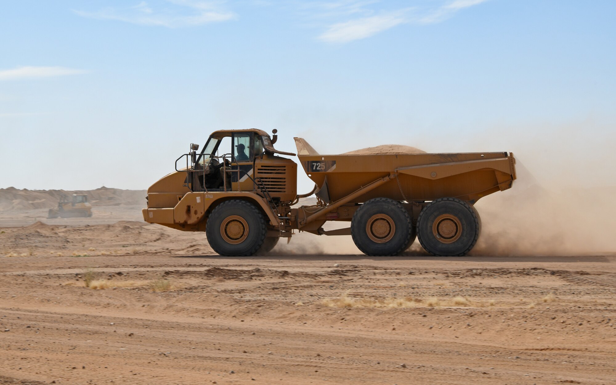 A U.S. Airman deployed with the 819th Expeditionary Rapid Engineer Deployable Heavy Operational Repair Squadron Engineer team drives a dump truck across Nigerien Air Base 201, Niger, Dec. 13, 2019. In Niger, deployed RED HORSE teams are continually improving base infrastructure and building new facilities for current and future missions. (U.S. Air Force photo by Staff Sgt. Alex Fox Echols III)