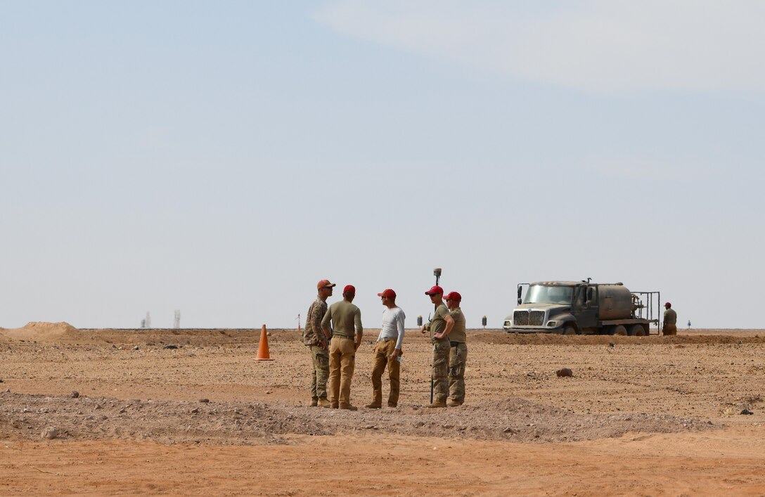 U.S. Airmen deployed with the 819th Expeditionary Rapid Engineer Deployable Heavy Operational Repair Squadron Engineer team conduct a ground survey at Nigerien Air Base 201, Niger, Dec. 13, 2019. In Niger, deployed RED HORSE teams are continually improving base infrastructure and building new facilities for current and future missions. (U.S. Air Force photo by Staff Sgt. Alex Fox Echols III)