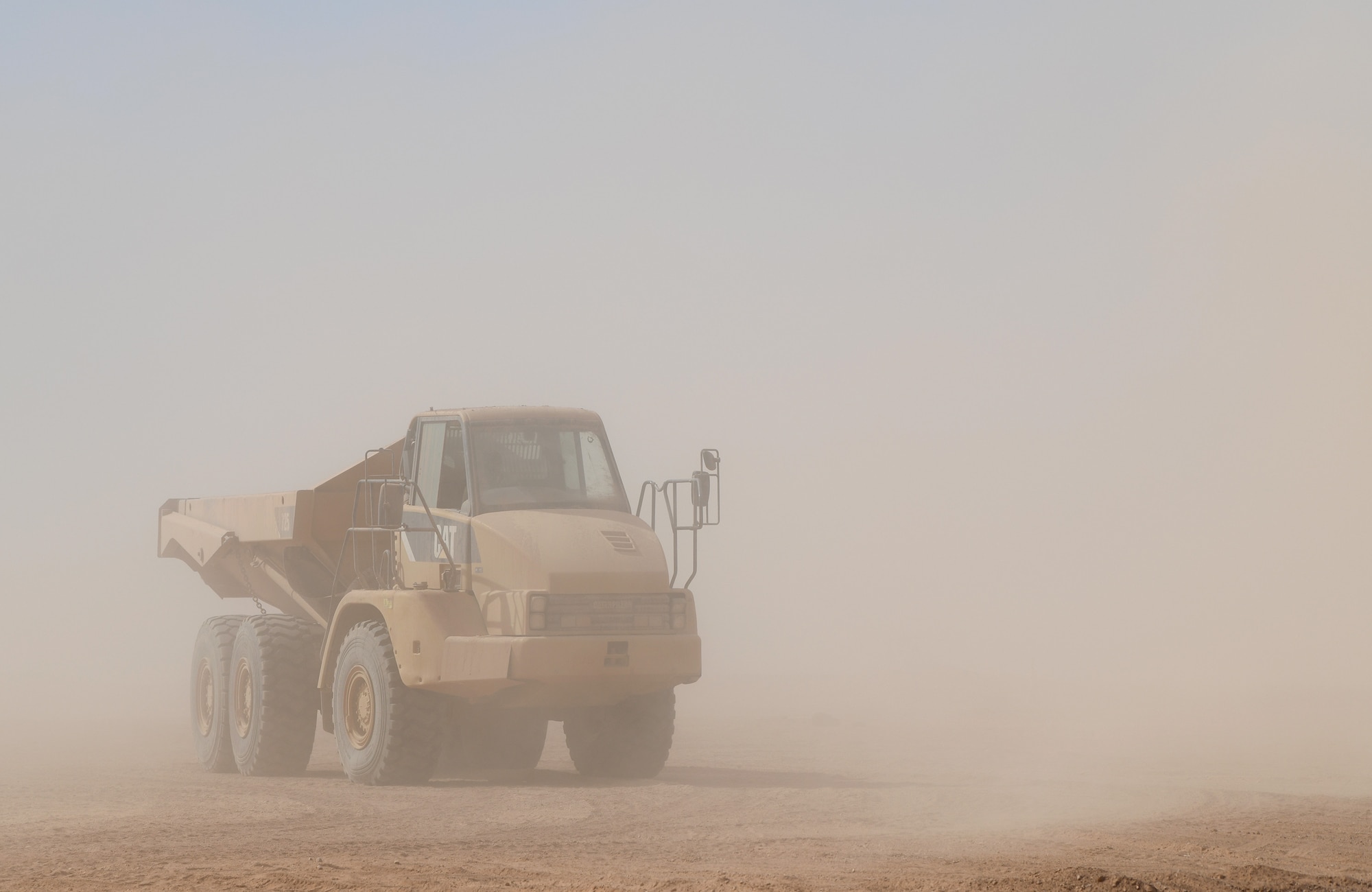 A U.S. Airman deployed with the 819th Expeditionary Rapid Engineer Deployable Heavy Operational Repair Squadron Engineer team drives a dump truck across Nigerien Air Base 201, Niger, Dec. 13, 2019. In Niger, deployed RED HORSE teams are continually improving base infrastructure and building new facilities for current and future missions. (U.S. Air Force photo by Staff Sgt. Alex Fox Echols III)