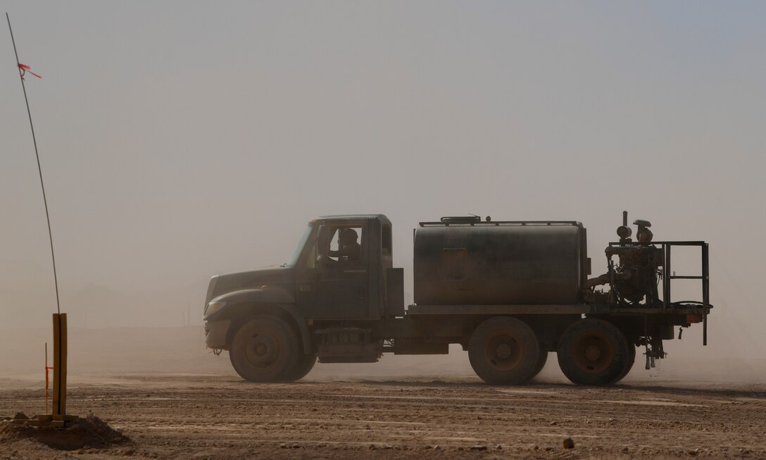 A U.S. Airman deployed with the 819th Expeditionary Rapid Engineer Deployable Heavy Operational Repair Squadron Engineer team drives a tanker truck across Nigerien Air Base 201, Niger, Dec. 13, 2019. In Niger, deployed RED HORSE teams are continually improving base infrastructure and building new facilities for current and future missions. (U.S. Air Force photo by Staff Sgt. Alex Fox Echols III)