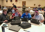 Soldiers with the Pennsylvania National Guard Cyber Branch and Recruiting and Retention Battalion engaged a group of 18 high school students in the new Wi-Fighter cyber challenge Dec. 12 at DeSales University in Center Valley, Pa. The winning team from Monroe Career and Technical Institute from right to left is: Chase Blecker, Rocco Susinskas, Jordan McGrath, and Liam Travers.