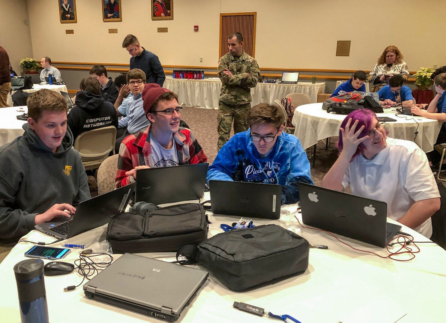 Soldiers with the Pennsylvania National Guard Cyber Branch and Recruiting and Retention Battalion engaged a group of 18 high school students in the new Wi-Fighter cyber challenge Dec. 12 at DeSales University in Center Valley, Pa. The winning team from Monroe Career and Technical Institute from right to left is: Chase Blecker, Rocco Susinskas, Jordan McGrath, and Liam Travers.