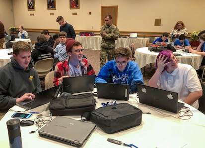 Soldiers with the Pennsylvania National Guard Cyber Branch and Recruiting and Retention Battalion engaged a group of 18 high school students in the new Wi-Fighter cyber challenge Dec. 12 at DeSales University in Center Valley, Pa. The winning team from Monroe Career and Technical Institute from right to left is: Chase Blecker, Rocco Susinskas, Jordan McGrath, and Liam Travers.