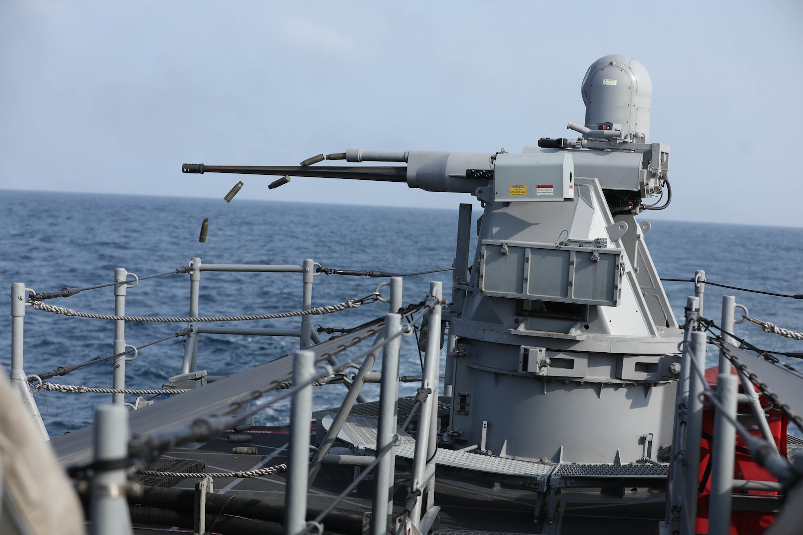 A MK-38 machine gun aboard the coastal patrol ship USS Sirocco (PC 6) fires rounds at simulated enemy ships as part of Griffin Missile Exercise 19. The exercise demonstrated a proven capability for the ships to defend themselves against small boat threats and ensure maritime security through key chokepoints in the U.S. Central Command area of responsibility.