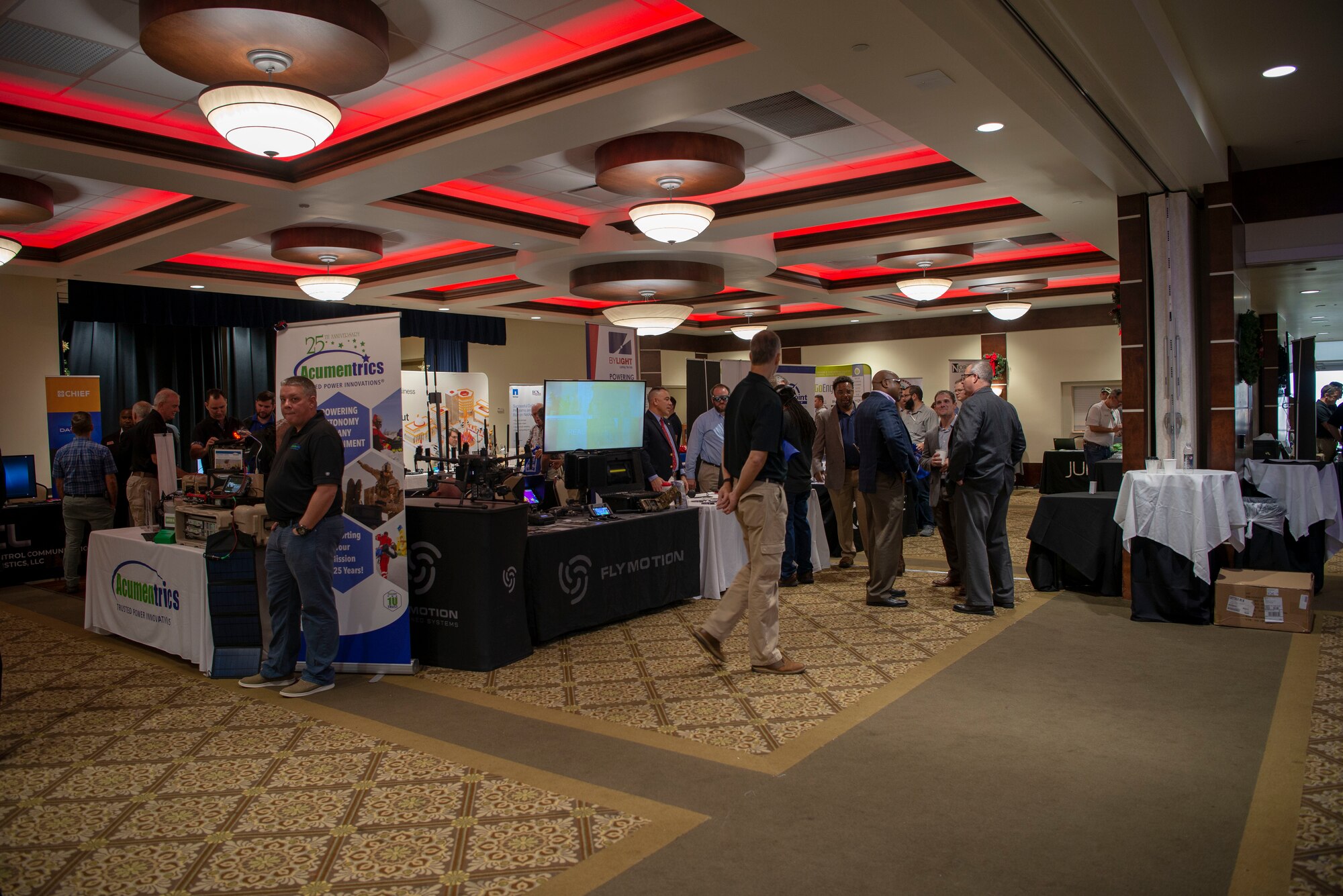Technology-based company representatives interact with service members during the annual Tech Expo at MacDill Air Force Base, Fla., Dec. 13, 2019. The 6th Force Support Squadron supported the event which was hosted by the Armed Forces Communications and Electronics Associations, Tampa-St. Petersburg Chapter and directed by Federal Direct Access Expositions.