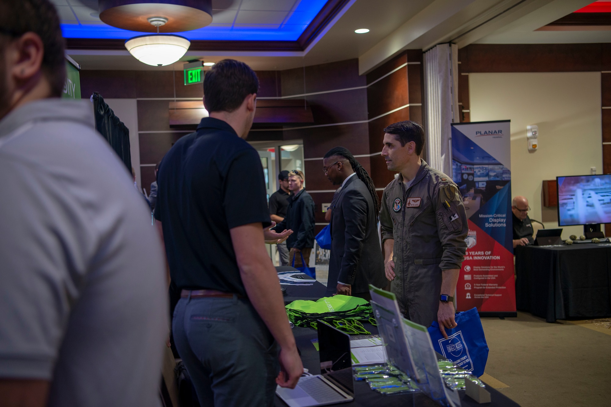 A U.S. Air Force pilot with U.S. Central Command speaks with vendors during the annual Tech Expo at MacDill Air Force Base, Fla., Dec. 13, 2019. Team MacDill supported more than 60 companies who flew in from around the country to speak about the benefits of technology in modern military life.