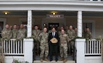 Officers and senior non-commissioned officers assigned to the New York Army National Guard's 42nd Infantry Division gather on the porch of the Central House Hotel in Germantown, N.Y., following a professional development lecture on Middle Eastern history by Bard College professor Sean McMeekin (center) Dec.13, 2019. McMeekin was asked to speak so the leaders could better understand the history of the region before the division deploys to Kuwait in 2020. The session was held in the hotel to accommodate the professor's schedule.