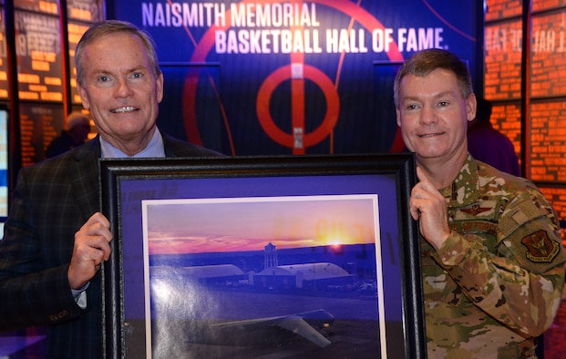 Col. Craig Peters, 439th Airlift Wing commander, presents a photo of Westover Air Reserve Base to John Doleva, Naismith Memorial Basketball Hall of Fame president and CEO, in Springfield, Massachusetts on Dec. 18, 2019. The Basketball Hall of Fame hosted a job fair for Westover in September 2019. (U.S Air Force photo by Airman Julia Howell)