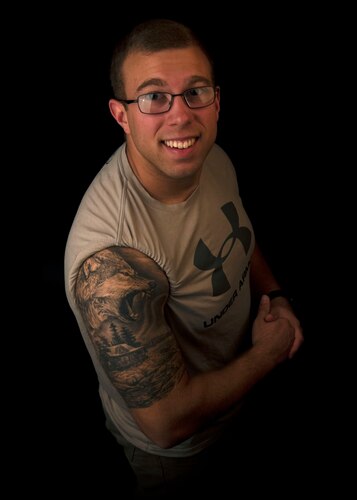 Photo of an Airman displaying a tattoo symbolizing his life perspective