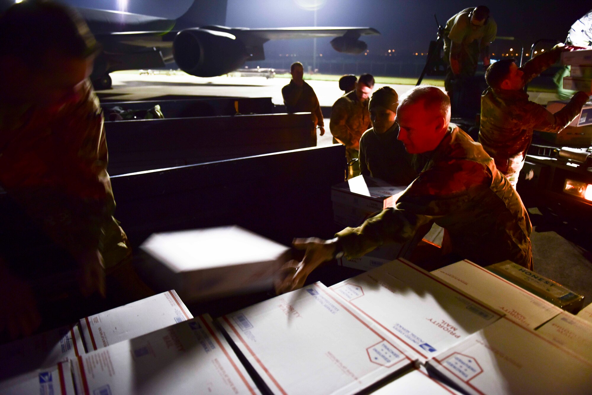 U.S. Air Force Airmen assigned to the 22nd Expeditionary Air Refueling Squadron load care packages onto a truck Dec. 7, 2019, at Incirlik Air Base, Turkey. Sending care packages is a tradition in which friends, families, colleagues or volunteers send boxes of goods to troops stationed overseas. (U.S. Air Force photo by Senior Airman Trevor Gordnier)