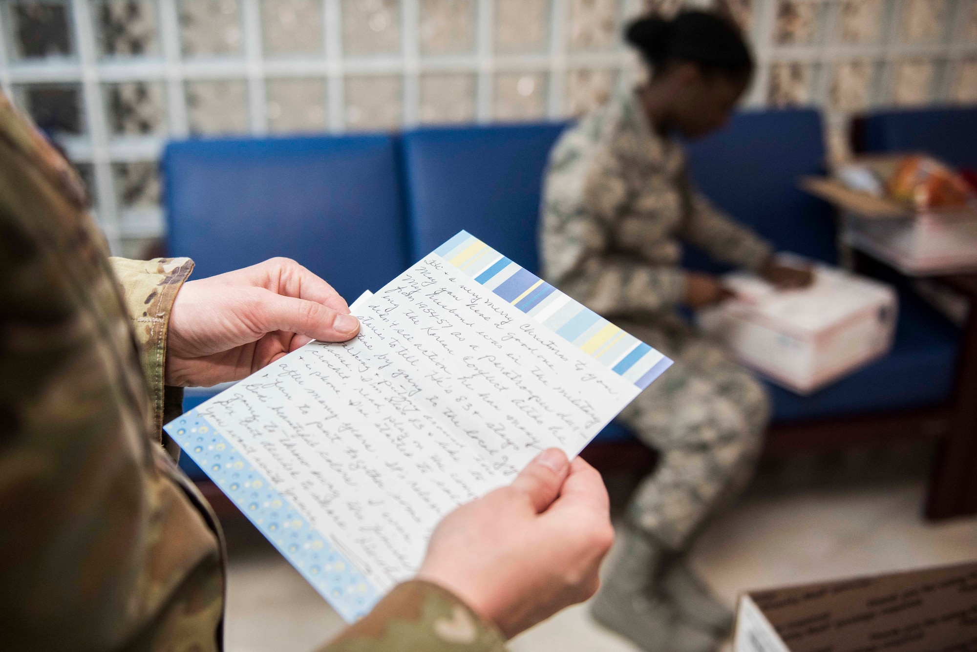 U.S. Air Force Master Sgt. Mandy Mueller, 39th Medical Operations Squadron medical services flight chief, reads a holiday letter Dec. 11, 2019, at Incirlik Air Base, Turkey. The 39th MDG received a delivery of care packages from church volunteers in Murrysville, Pennsylvania, as a gesture of holiday giving. (U.S. Air Force photo by Staff Sgt. Joshua Magbanua)