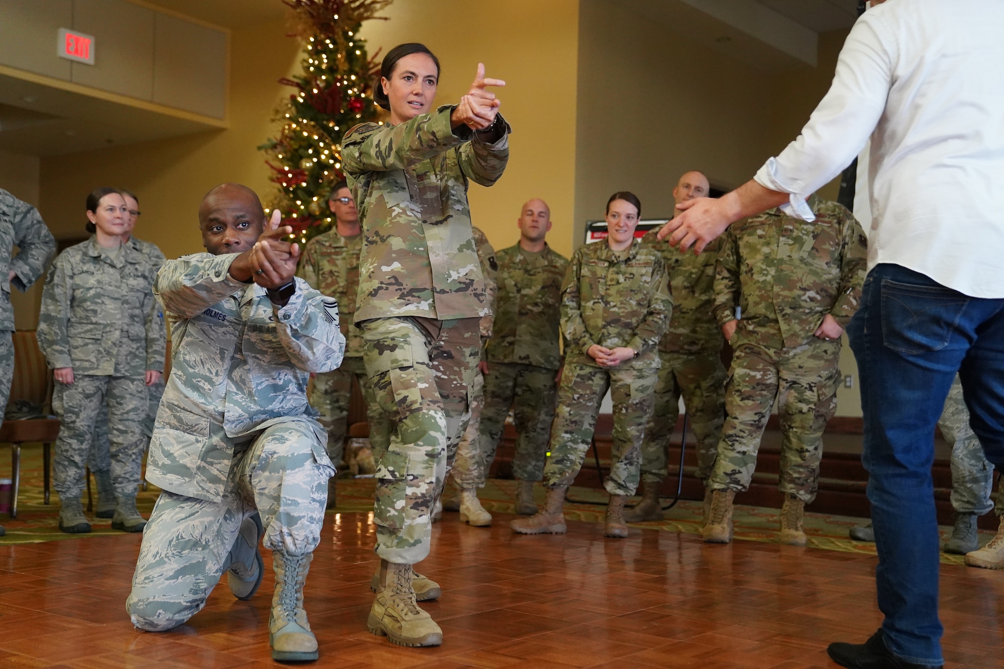 U.S. Air Force Col. Heather Blackwell, 81st Training Wing commander, and SMSgt. Patrick Holmes, 335th Training Squadron first sergeant, participate in an activity for the 'Improv to Improve' course in the Bay Breeze Event Center at Keesler Air Force Base, Mississippi, Dec. 10, 2019. Improv to Improve is an improvisation comedy resiliency class that engages military members in a safe interactive learning environment. The purpose of the class is to help combat life stress and adversity in an unconventional way. (U.S. Air Force photo by Airman 1st Class Spencer Tobler)