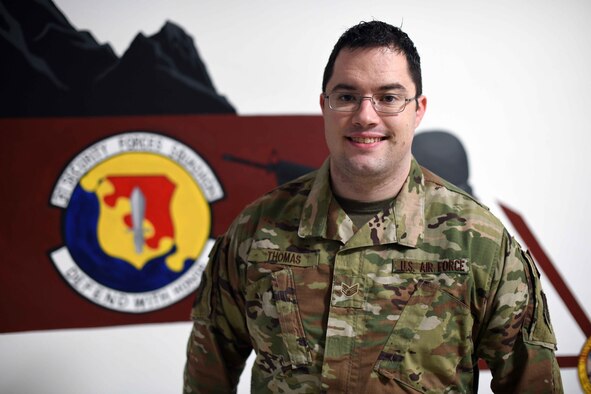 U.S. Air Force Staff Sgt. Keifer Thomas, a confinement NCO from the 31st Security Forces Squadron, poses for a photo at Aviano Air Base, Dec. 19, 2019.