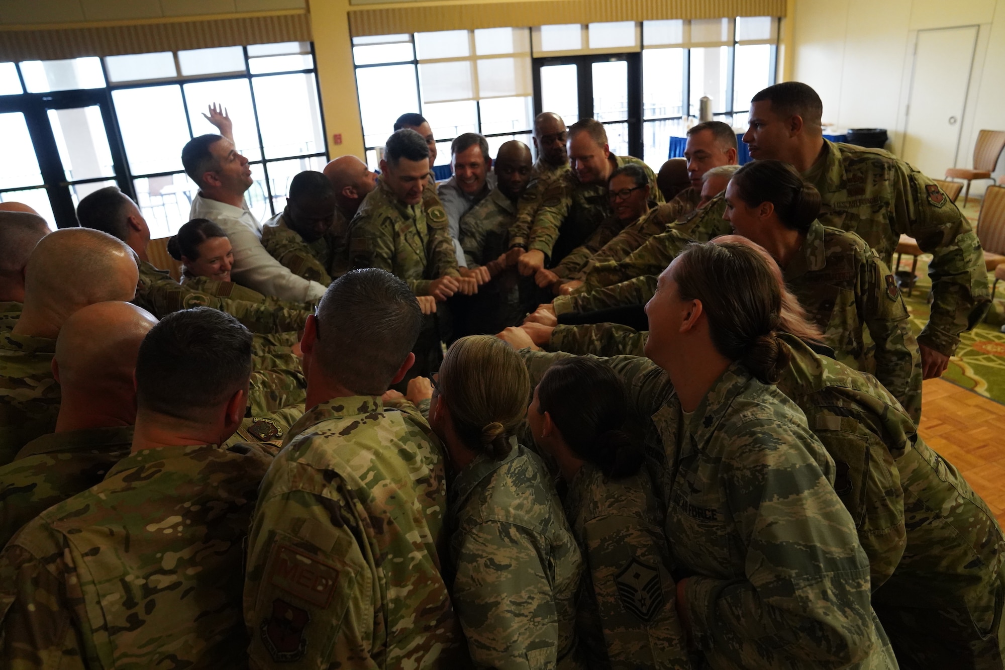 U.S. Air Force Airmen participate in an activity during the 'Improv to Improve' course in the Bay Breeze Event Center at Keesler Air Force Base, Mississippi, Dec. 10, 2019. Improv to Improve is an improvisation comedy resiliency class that engages military members in a safe interactive learning environment. The purpose of the class is to help combat life stress and adversity in an unconventional way. (U.S. Air Force photo by Airman 1st Class Spencer Tobler)