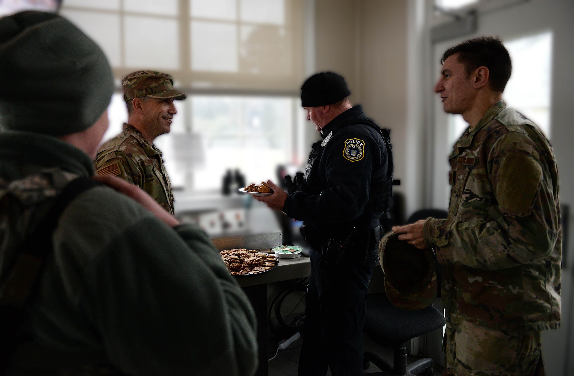 Airmen from the 14th Security Forces Squadron receive cookies from volunteers during the Columbus Spouses Club Cookie Drive Dec. 17, 2019, on Columbus Air Force Base, Miss. Donations were provided by the base populace as well as Zachary’s, Chick-fil-A, McAlister’s Deli, Sweet Peppers Deli, and Lost Pizza Co. In addition, Zachary’s provided as an off-base drop-off location for local volunteers to donate cookies for the drive. (U.S. Air Force photo by Airman 1st Class Hannah Bean)