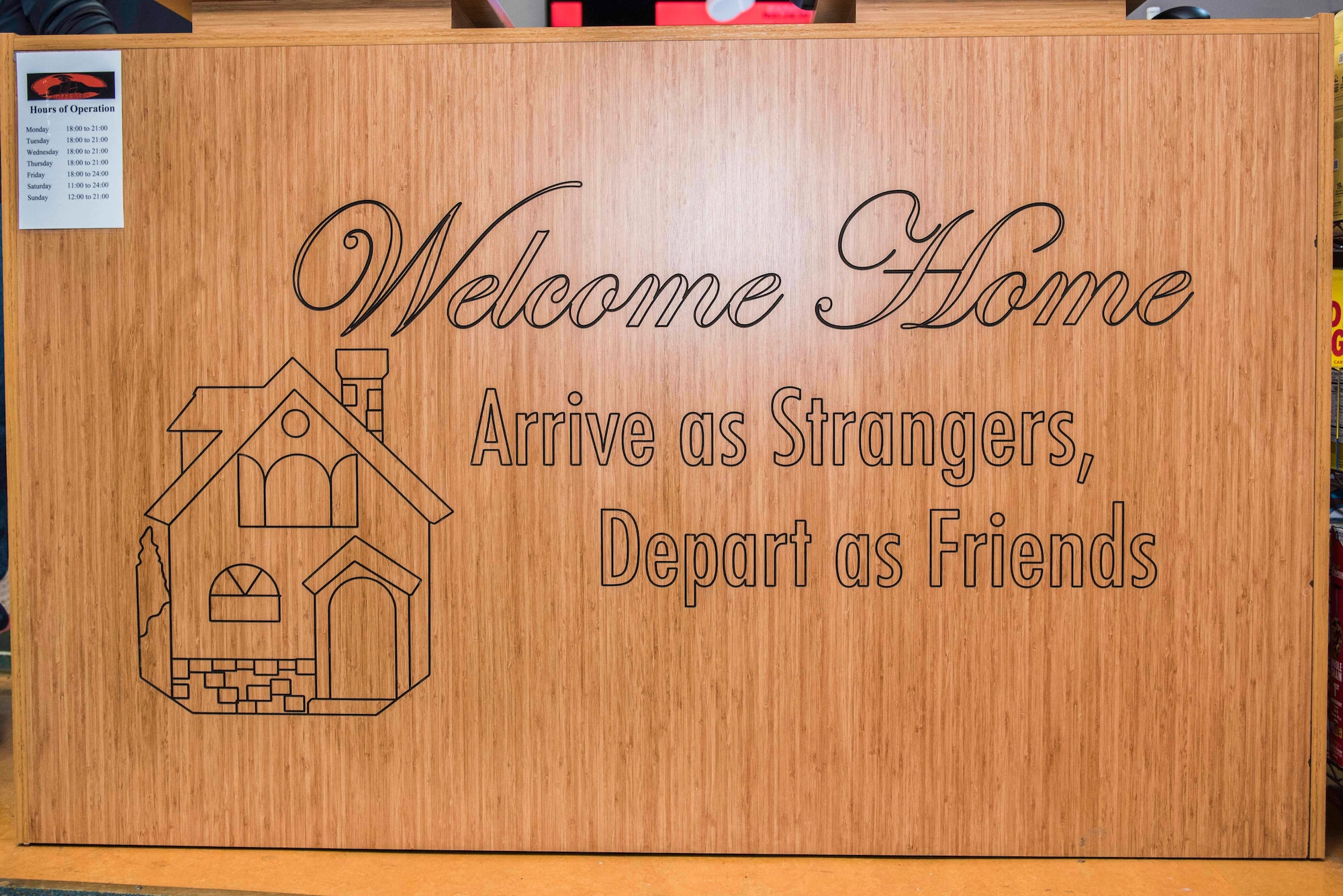 A wooden welcome sign