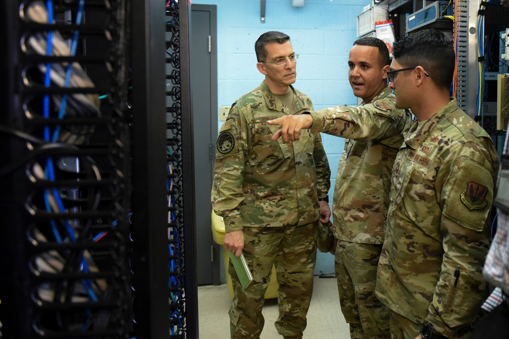 The National Guard Bureau’s A/6 communications directorate team tours the network control center at the 156th Wing, Puerto Rico Air National Guard, Dec. 10, 2019, to assess and finalize plans to move the NCC after the building it's in was severely damaged by Hurricane Maria in 2017.