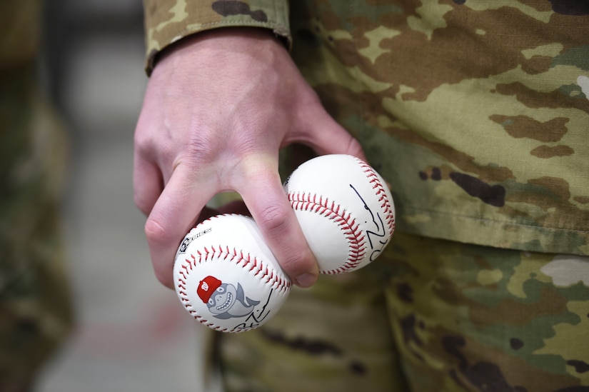 An Airman holds baseballs signed by Ryan Zimmerman, Washington Nationals first baseman, during a World Series trophy display event at Joint Base Andrews, Md., Dec. 17, 2019. Zimmerman and his wife toured sections of the base and showed off the trophy the Nationals won this year. (U.S. Air Force photo by Airman 1st Class Spencer Slocum)