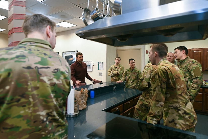 Airmen from the 1st Helicopter Squadron talk with Ryan Zimmerman, Washington Nationals first baseman, during a World Series trophy display event at Joint Base Andrews, Md., Dec. 17, 2019. Airmen had the opportunity to speak with Zimmerman and take pictures with the 2019 World Series trophy. (U.S. Air Force photo by Airman 1st Class Spencer Slocum)