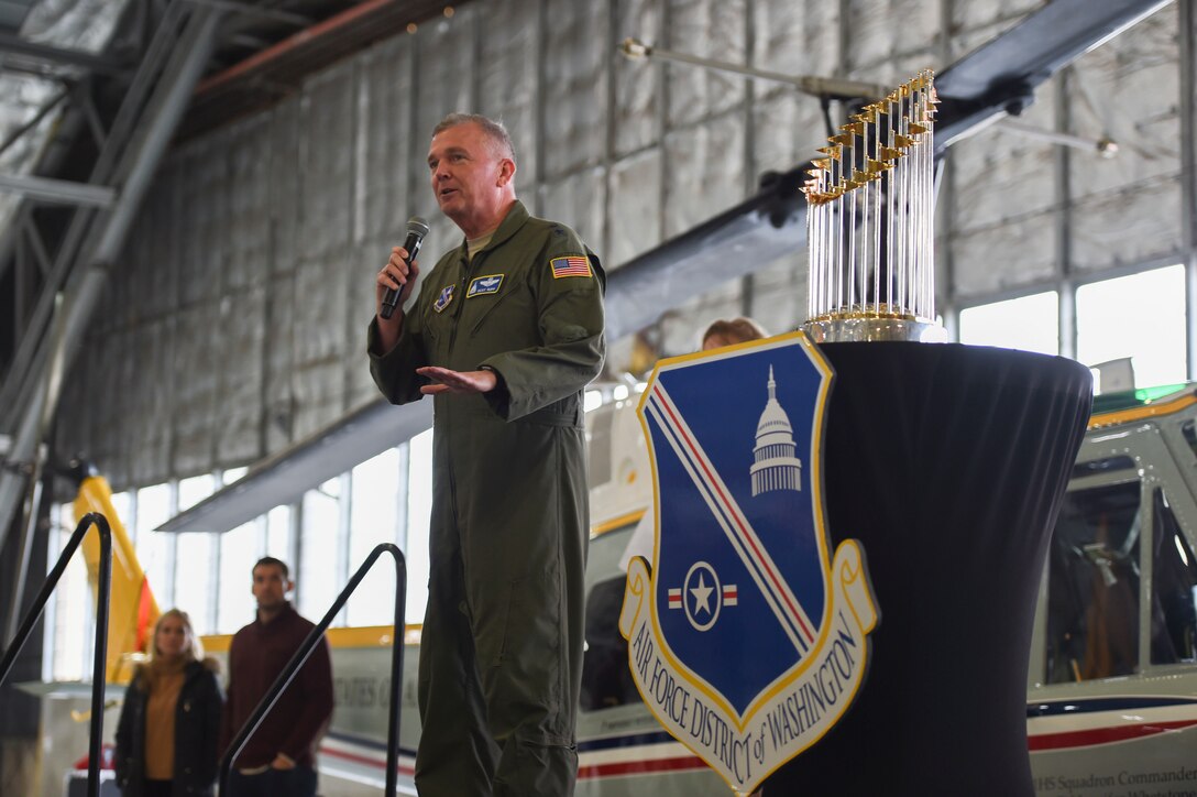 Air Force Maj. Gen. Ricky N. Rupp, 320th Air Expeditionary Wing and Air Force District of Washington commander, speaks to attendees at a World Series trophy display at Joint Base Andrews, Md., Dec. 17, 2019. The Washington Nationals won the 2019 World Series and brought the trophy to JBA to connect with base personnel. (U.S. Air Force photo by Airman 1st Class Spencer Slocum)