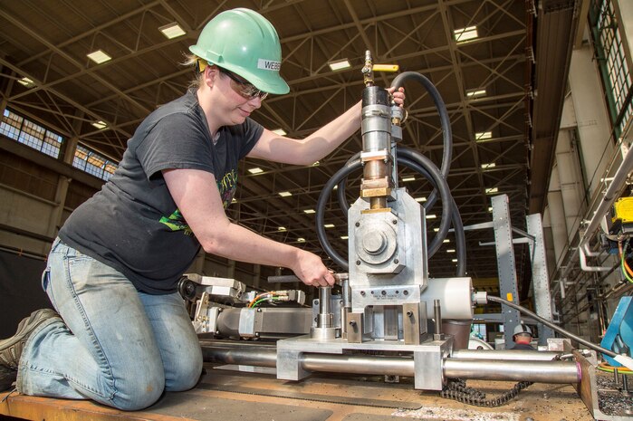 A Puget Sound Naval Shipyard & Intermediate Maintenance Facility employee from Shop 11, Shipfitters, demonstrates portable cold-cutting technology.