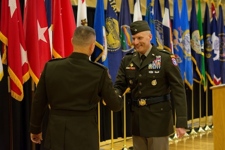 Two male Soldiers shake hands