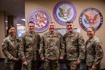 Joint Task Force Civil Support (JTF-CS) Commanding General U.S. Army Maj. Gen. William “Bill” Hall poses for a photo with 633rd Air Base Wing Commander U.S. Air Force Col. Clinton Ross, U.S. Air Force Command Chief Master Sgt. Greg Peterson, 733rd Mission Support Group Commander U.S. Army Col. Jennifer Walkawicz, and Command Sgt. Maj. Abby Macdonald during their visit to JTF-CS headquarters. The visit included a brief with the JTF-CS leadership and a tour of the command’s headquarters. (Official DoD photo by Mass Communication Specialist 3rd Class Michael Redd/RELEASED)