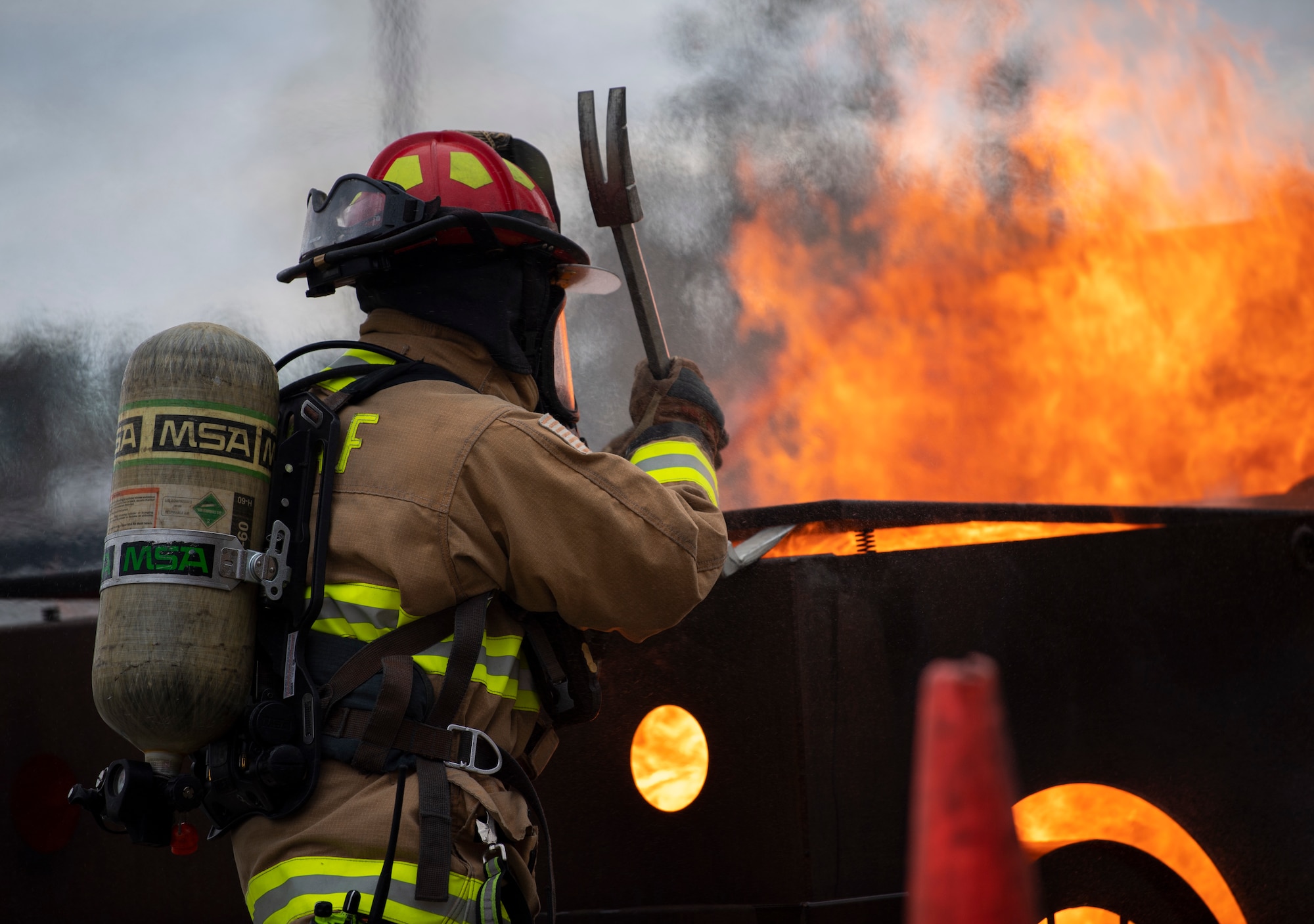 Ricardo Campos, 60th Civil Engineer Squadron fire protection lead, demonstrates fire extinguishing procedures during the 60th Mission Support Group honorary commanders tour Dec. 6, 2019, at Travis Air Force Base, California. Travis AFB’s honorary commander program allows base leadership to develop relationships with local, civic and business leaders. It also gives the opportunity to learn about the surrounding communities. (U.S. Air Force photo by Senior Airman Jonathon Carnell)