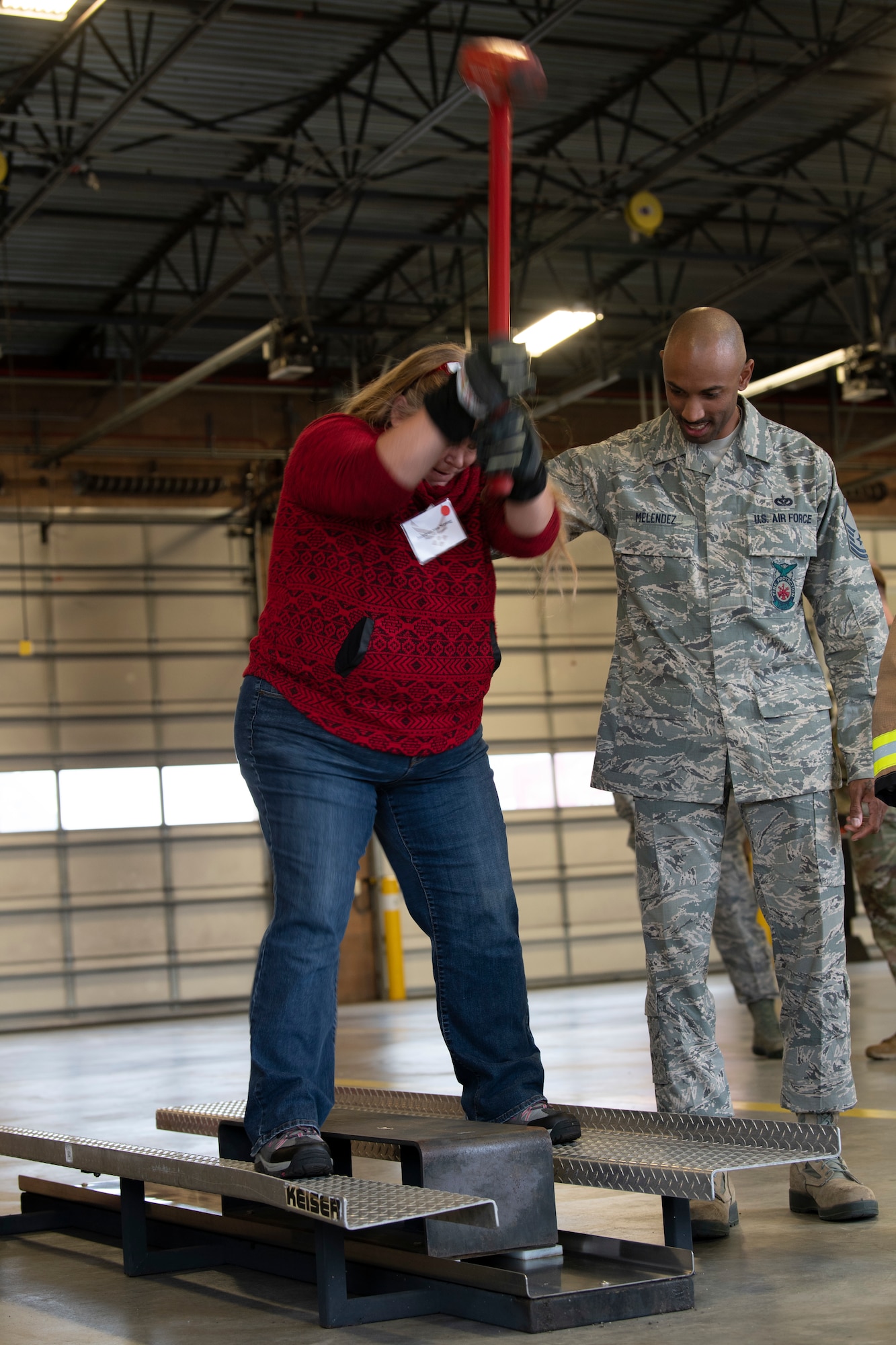 Jocelyne von Strong, 60th Air Mobility Wing Operations Group honorary commander, does a firefighter workout during the 60th Mission Support Group’s honorary commanders tour Dec. 6, 2019, at Travis Air Force Base, California. Travis AFB’s honorary commanders program allows base leadership to develop relationships with local, civic and business leaders, foster civic appreciation of the Air Force mission and its Airmen, maximize opportunities to share the Air Force story with new stewards and to communicate mutual interest, challenges and concerns that senior leaders and civilian stakeholders have in common.. (U.S. Air Force photo by Senior Airman Jonathon Carnell)