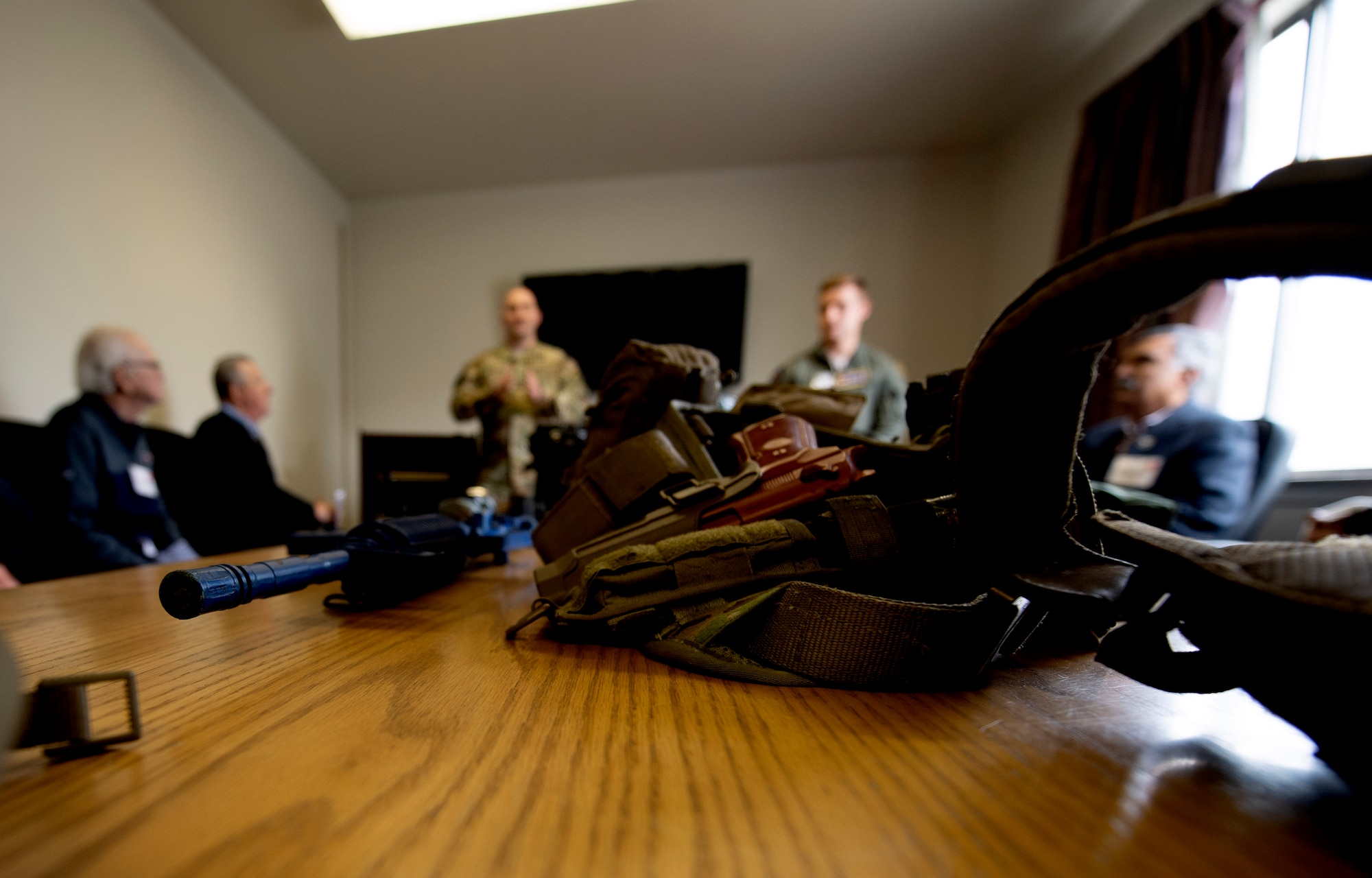 60th Security Forces Squadron Phoenix Ravens describes their mission and gear to honorary commanders during the 60th Mission Support Group honorary commanders tour Dec. 6, 2019, at Travis Air Force Base, California. Travis AFB’s honorary commander program allows base leadership to develop relationships with local, civic and business leaders,  foster civic appreciation of the Air Force mission and its Airmen, maximize opportunities to share the Air Force story with new stewards and to communicate mutual interest, challenges and concerns that senior leaders and civilian stakeholders have in common. (U.S. Air Force photo by Senior Airman Jonathon Carnell)