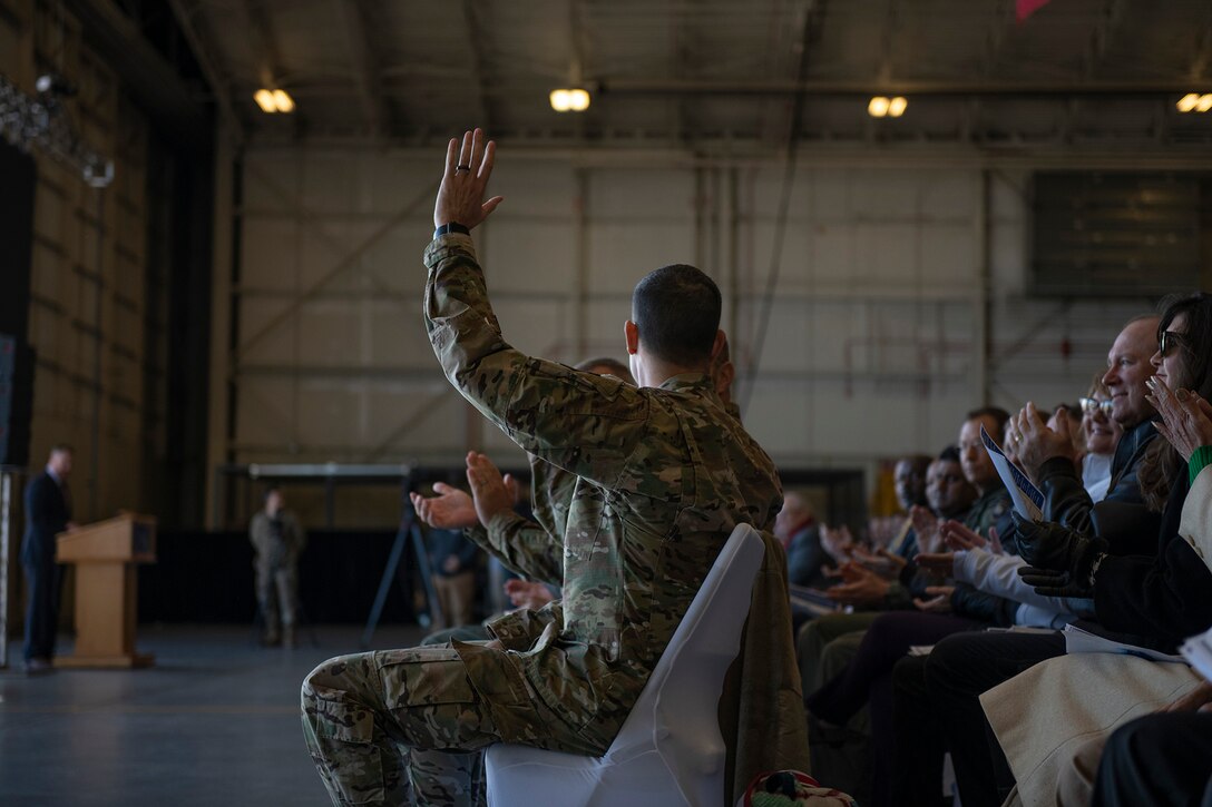 Col. Merrill waves at crowd.