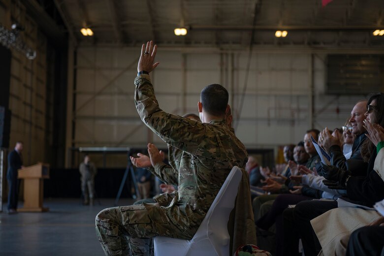 Col. Merrill waves at crowd.