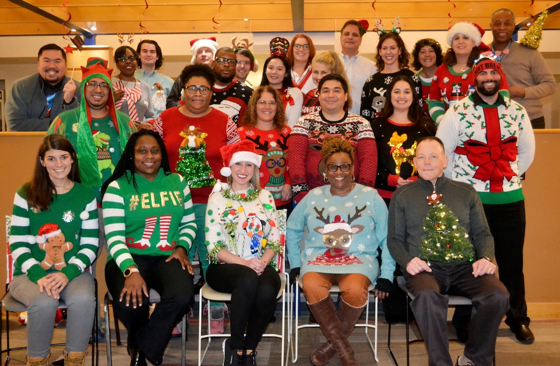 Employees pose for a photo during the Medical Culture Improvement Team’s Ugly Holiday Sweater Day contest at DLA Troop Support Dec. 17, 2019 in Philadelphia.